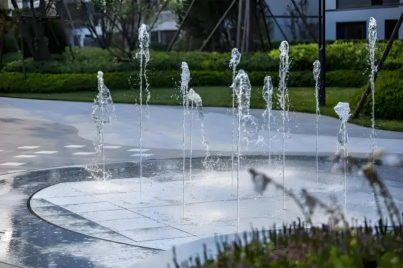 Fountain plaza paved with large-format stone tiles