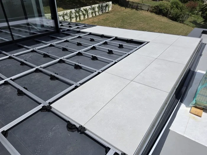 Outdoor paved patio on pedestal grid