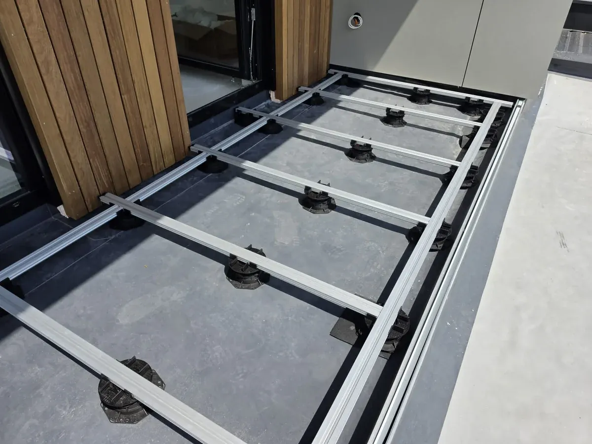 Aluminium joists clipped onto pedestals forming the substructure at a Slovenia mansion rooftop