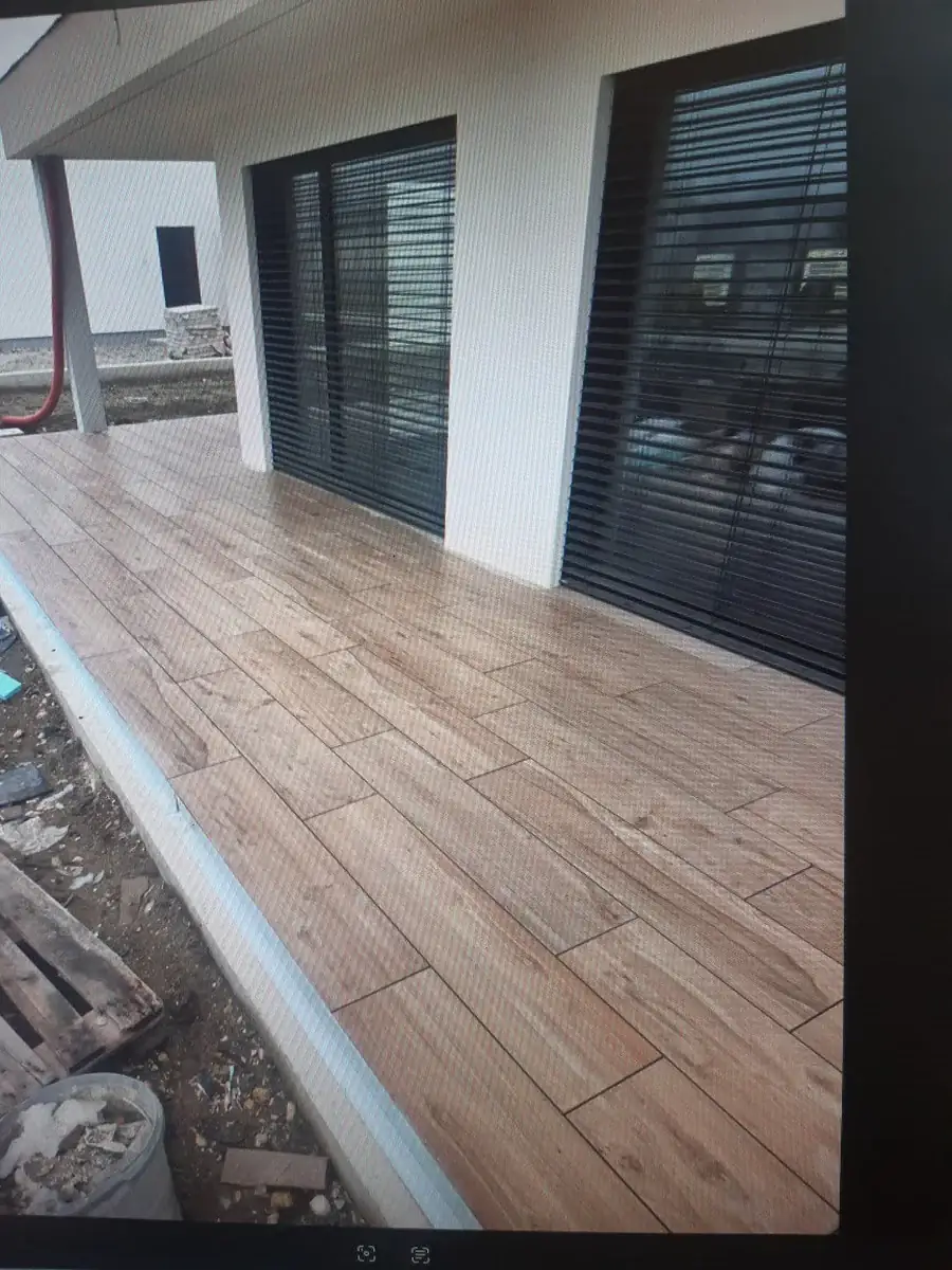 Long-format wood-look pavers laid on pedestals at a Slovenia private residence patio