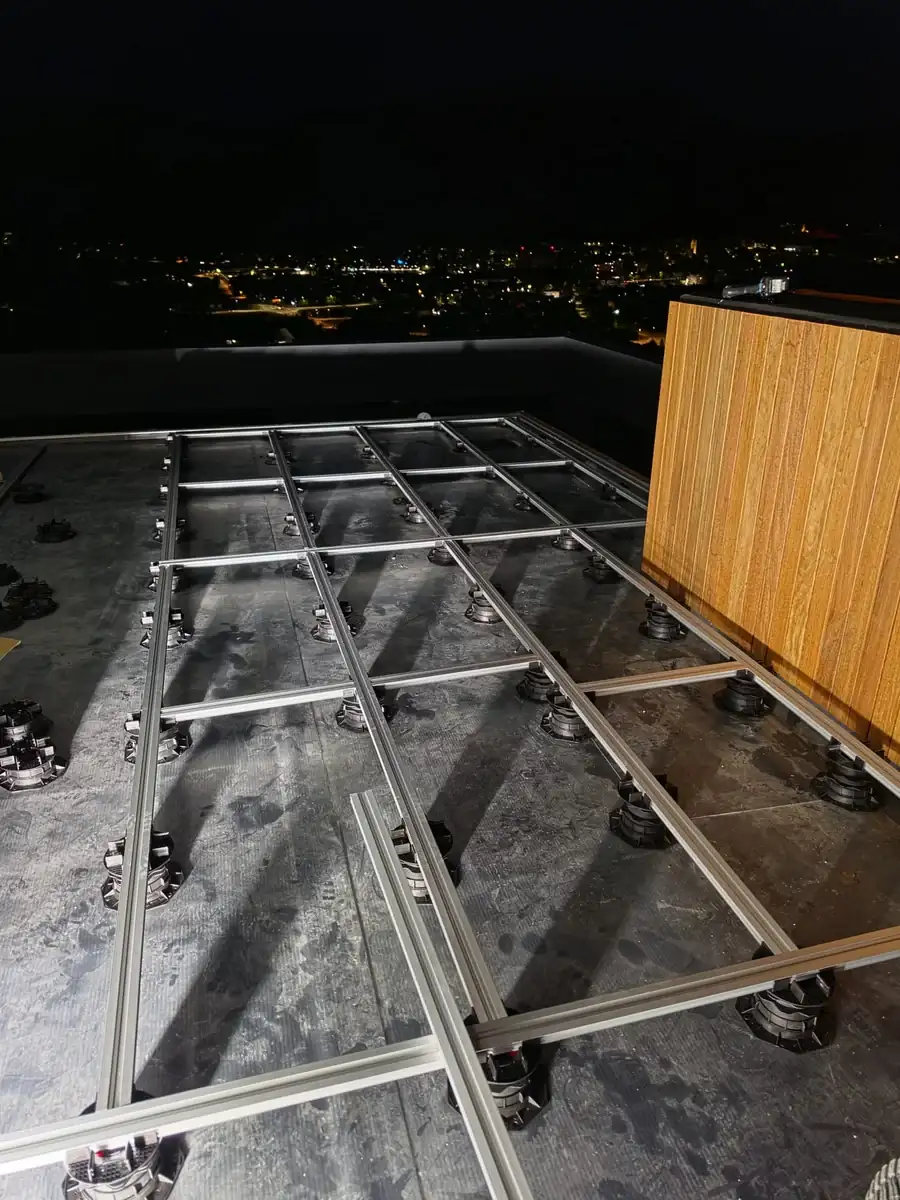 Pedestal grid continuing through the full-height sliding door at a Slovenia mansion rooftop