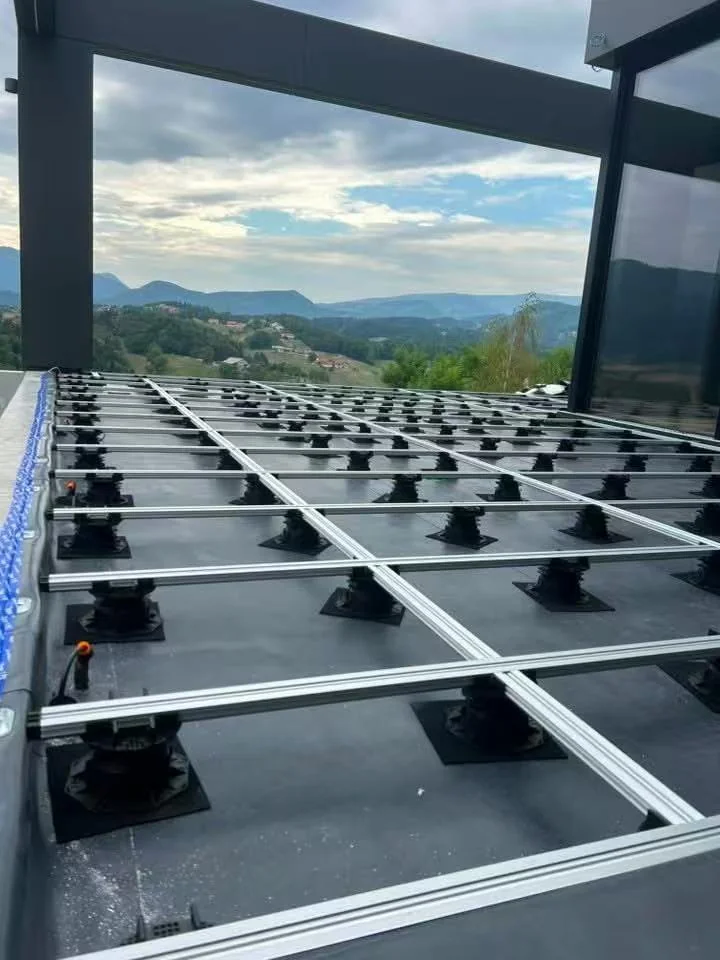 Perimeter pedestal grid running along the roof edge at a Slovenia mansion rooftop