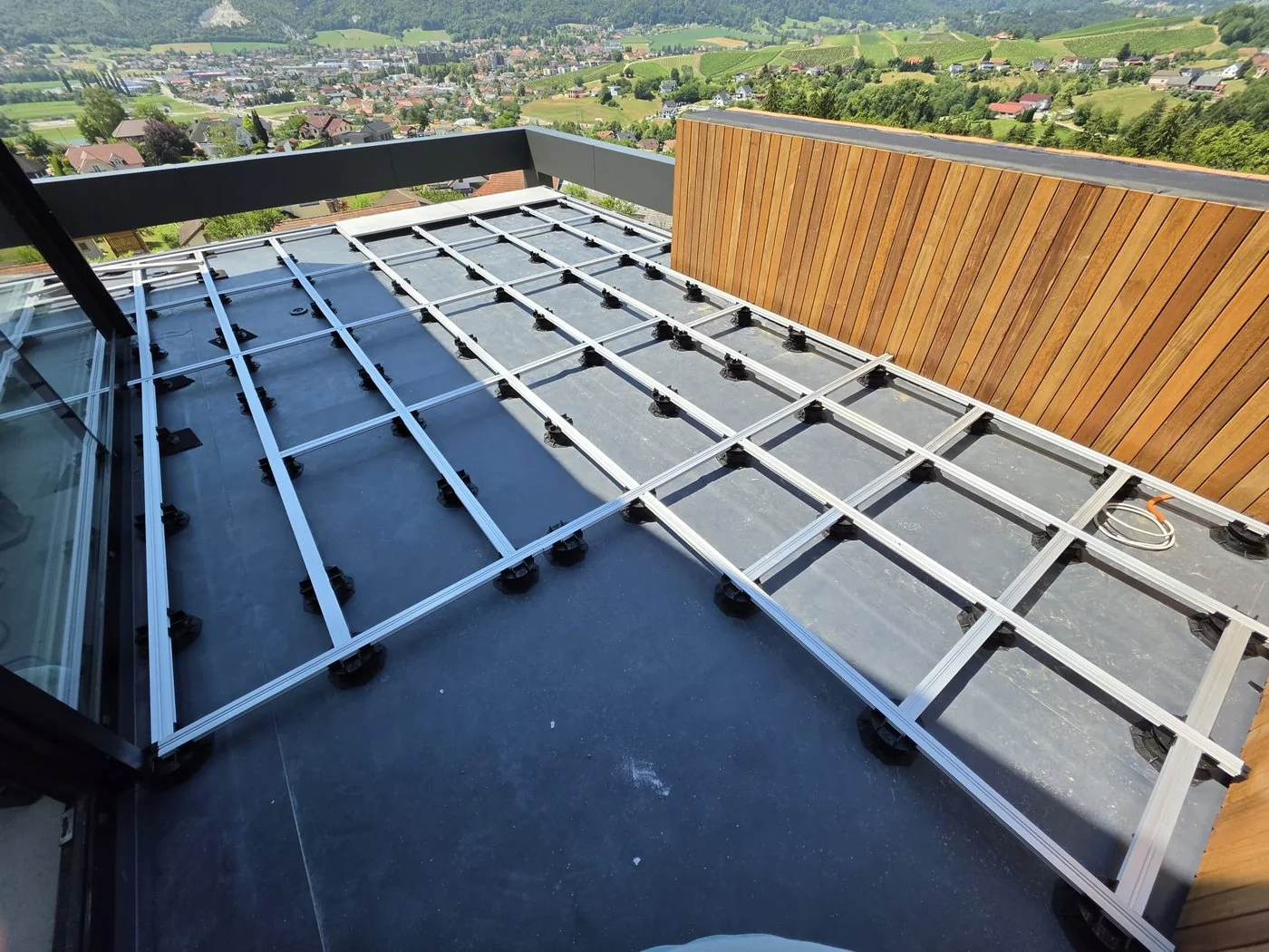 Vitaro adjustable pedestal grid on a real rooftop terrace project in Slovenia